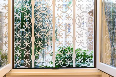 a window with a wrought iron window screen at Giardinetto 14 in Rome