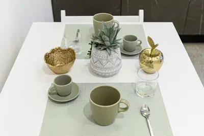 a white table with cups and saucers on it at Giardinetto 14 in Rome