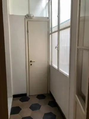 a door in a room with a tiled floor at Boschetto Apartment in Rome