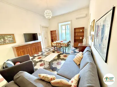 a living room with a couch and a table at Santa Maria Maggiore - Vittorio Emanuele House in Rome