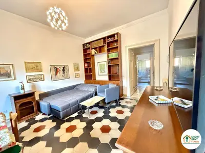 a living room with a couch and a table at Santa Maria Maggiore - Vittorio Emanuele House in Rome