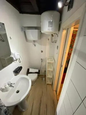 a bathroom with a sink and a toilet at La casetta ai fori imperiali in Rome