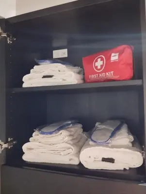 a shelf filled with lots of white folded towels at La casetta ai fori imperiali in Rome
