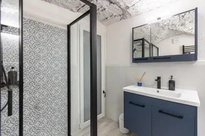 a bathroom with a sink and a mirror at Carpe Diem by Rental in Rome in Rome