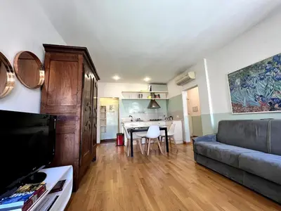 a living room with a couch and a table at Campo dei fiori - cozy and central apt in Rome