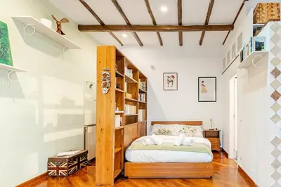 a kitchen and living room with a table and chairs at Rione Monty Balcony Studio in Rome