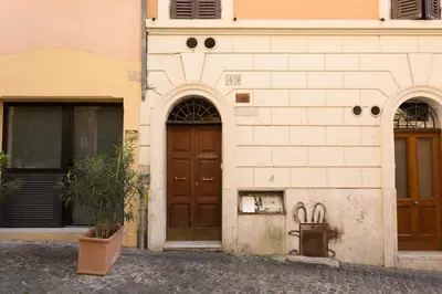a living room with a couch with pillows on it at Rione Monty Balcony Studio in Rome