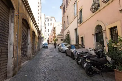 a white entertainment center with a television on top of it at Rione Monty Balcony Studio in Rome