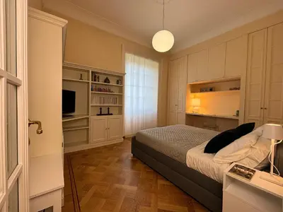 a bedroom with a bed and a television in it at Moon Cove, Villa Borghese Prestige Hideaway Rome in Rome
