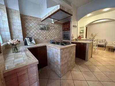 a kitchen with a stove and a counter top at La Camilla in Rome