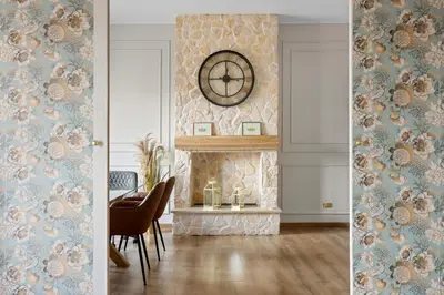 a dining room with a table and a clock on the wall at Maison G - new design apartment with balcony in Rome