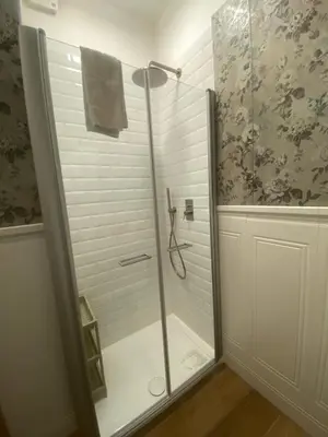 a shower with a glass door in a bathroom at Colosseo luxury home in Rome