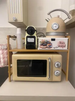 a microwave sitting on a counter in a kitchen at Colosseo luxury home in Rome