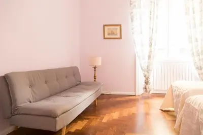 a living room with a couch and a window at Arcudi Romance Home in Rome