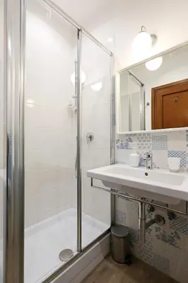 a bathroom with a shower and a sink at Arcudi Romance Home in Rome