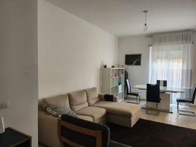 a living room with a couch and a table at P7 Casa Roma in Rome