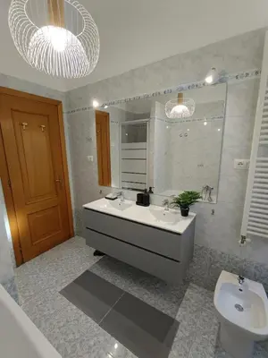 a bathroom with a sink and a toilet at CASA NONNO - Casa Vacanze in Rome