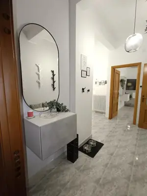 a bathroom with a sink and a mirror on the wall at CASA NONNO - Casa Vacanze in Rome