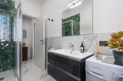 a bathroom with a sink and a shower at Casa di Gina in Rome