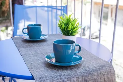 two blue coffee cups sitting on a table at Casa di Gina in Rome