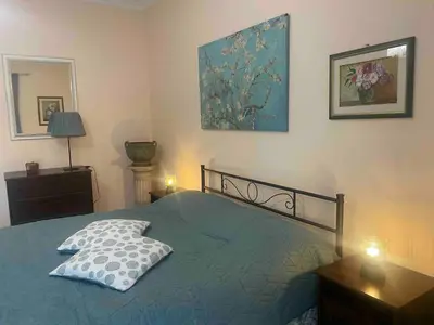 a bedroom with a bed with a pillow on it at Home Luxury Emy in Rome