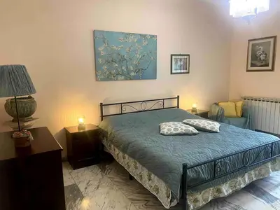 a bedroom with a bed with two pillows on it at Home Luxury Emy in Rome