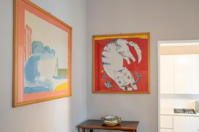 a room with a white door and a vase of flowers at Home d'Elite Ripetta - Spanish Steps in Rome