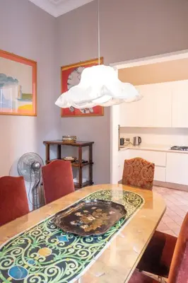 a kitchen with white cabinets and a stove at Home d'Elite Ripetta - Spanish Steps in Rome