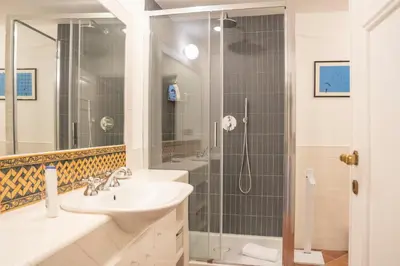 a bathroom with a sink and a shower at Home d'Elite Ripetta - Spanish Steps in Rome