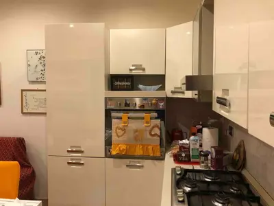 a kitchen with a stove and a counter top at Appartamento a due passi dalla Storia e dalla Movida Romana in Rome
