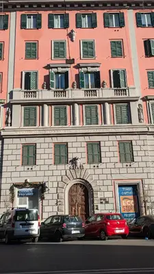 a large building with cars parked in front of it at Giuliana32 in Rome