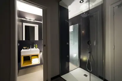 a bathroom with a shower and a sink at Atypical Rooms in Rome