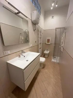 a bathroom with a sink and a toilet and a shower at Ostiense - San Paolo Garbatella - Università Roma 3 in Rome