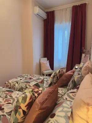 a hotel room with two beds and a window at Ostiense - San Paolo Garbatella - Università Roma 3 in Rome
