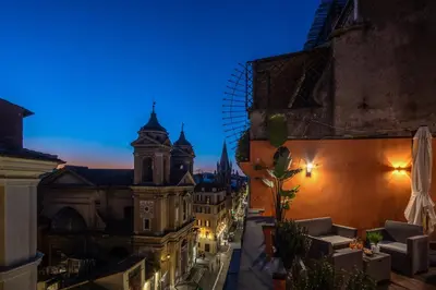 a view of a city skyline at night at Piazza di Spagna Comfort Rooms in Rome