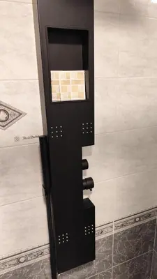a black object on the wall of a bathroom at Appartamento esclusivo Casalino Vatican Suite in Rome