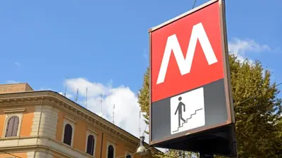 a sign in front of a building with a m sign at Appartamento esclusivo Casalino Vatican Suite in Rome