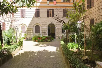 a building with a walkway in front of a building at LarissaRooms in Rome