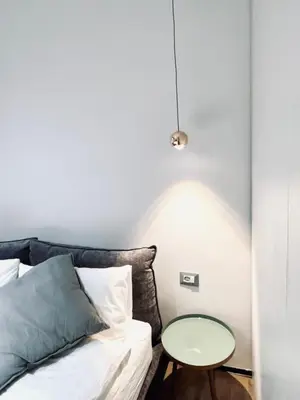 a bedroom with a bed and a glass table at Luxury Nest Ponte Milvio in Rome