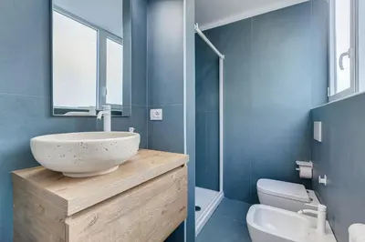 a bathroom with a bowl sink and a toilet at New opening Ponte Milvio in Rome