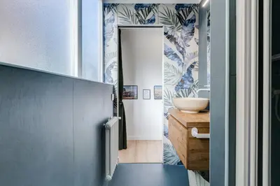 a bathroom with a sink and a mirror at New opening Ponte Milvio in Rome