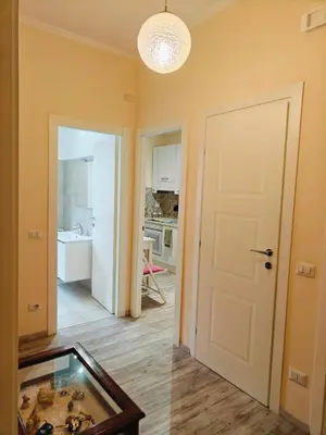 a room with a door and a room with a kitchen at B&B A casa da Mami in Rome