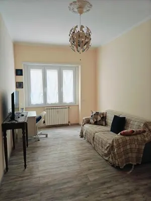 a living room with a couch and a table at B&B A casa da Mami in Rome