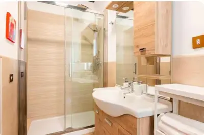 a bathroom with a shower and a sink and a toilet at Piazza Farnese house in Rome