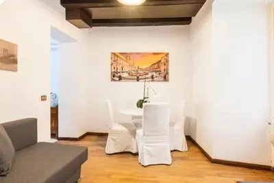 a living room with a couch and a table at Piazza Farnese house in Rome