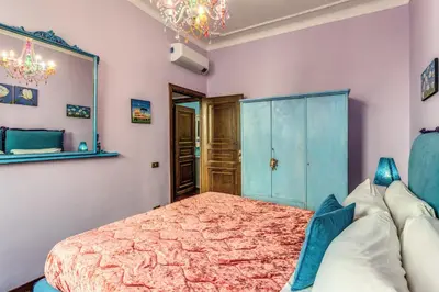 a bedroom with a bed and a mirror at dorholidayhome in Rome