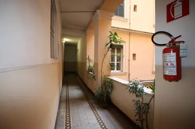 an empty hallway of a building with a fire extinguisher at Casa Vacanze Nonno Giulio in Rome