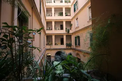 a statue in the courtyard of a building at Casa Vacanze Nonno Giulio in Rome