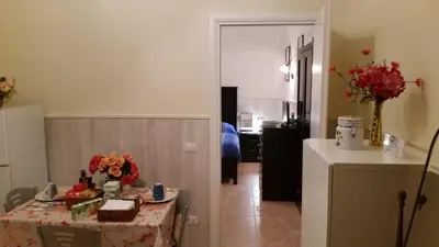 a living room with a table with a cake on it at Casa Vacanze Nonno Giulio in Rome