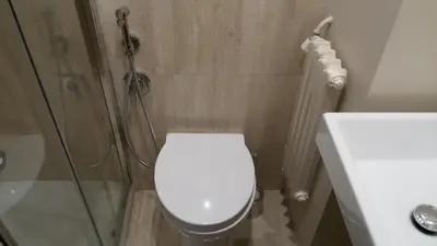 a bathroom with a shower and a toilet and a sink at Ad Vatican Suites in Rome